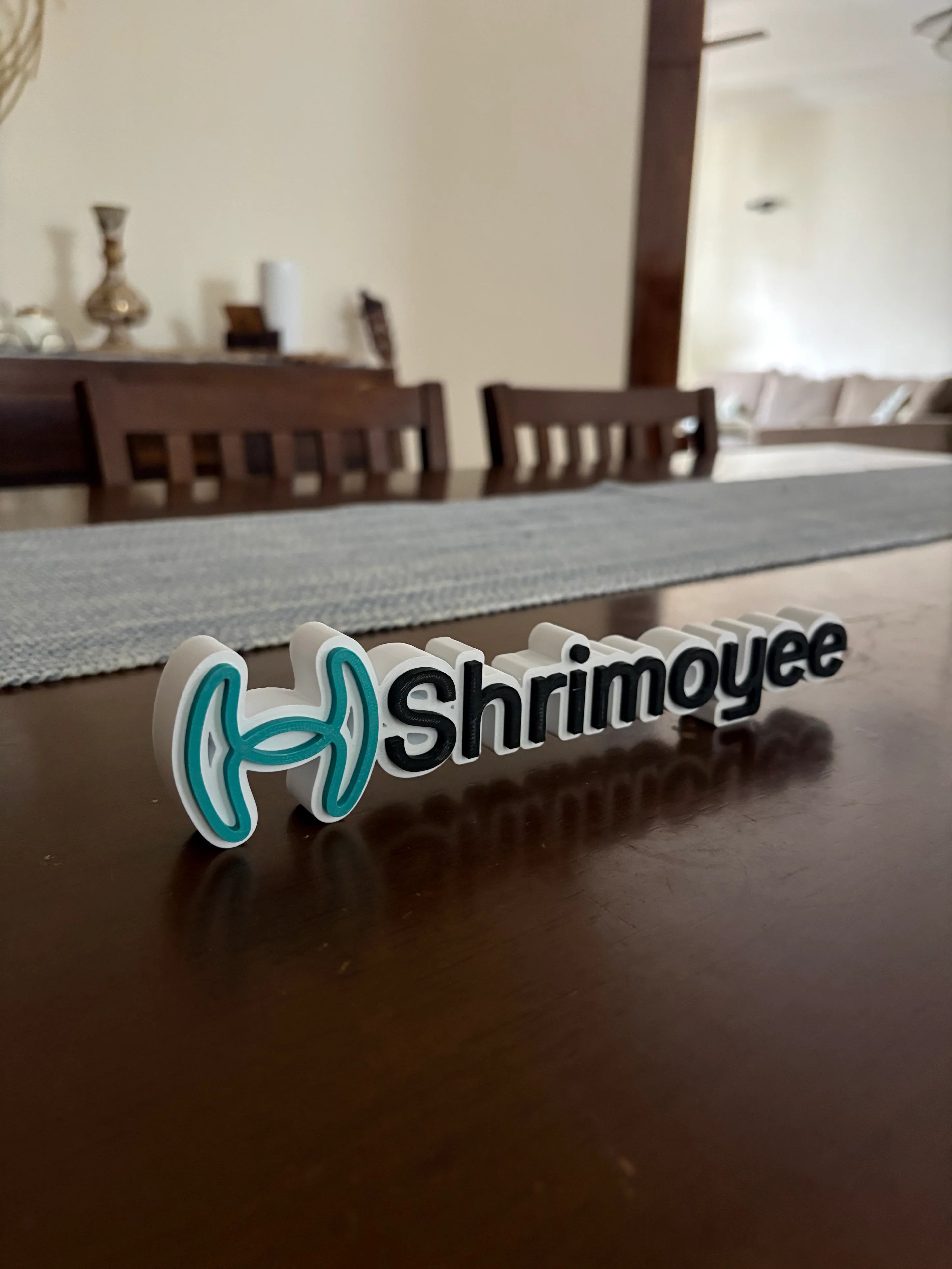 Company branded desk name sign on a table