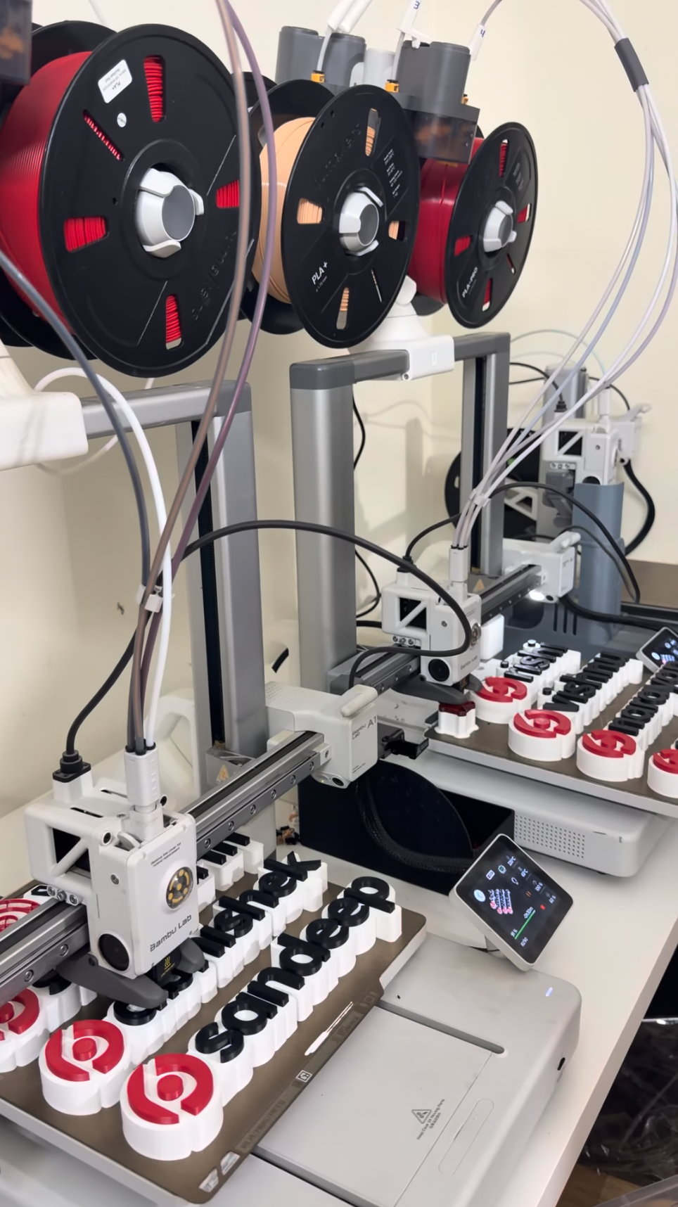 3D printers producing custom desk name signs