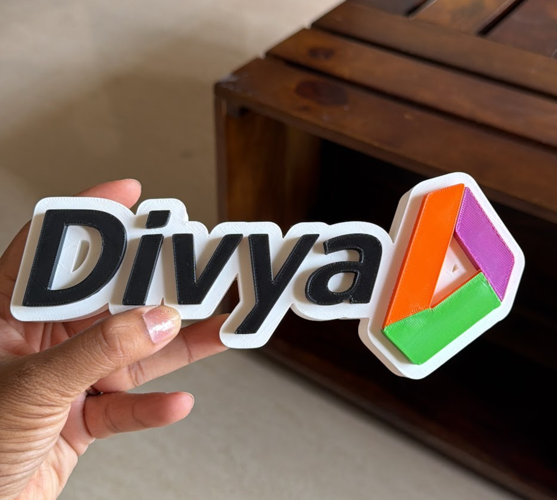 Custom desk name sign held by hand